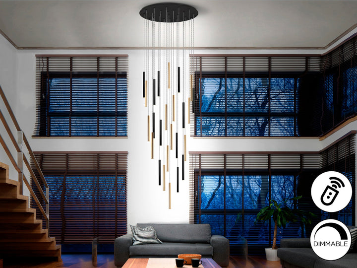 Lustră suspendată Schuller Varas Grand 25L cu douăzeci și cinci de coloane LED pe disc Ø90 cm — auriu lucios și negru mat, dimmable cu telecomandă.