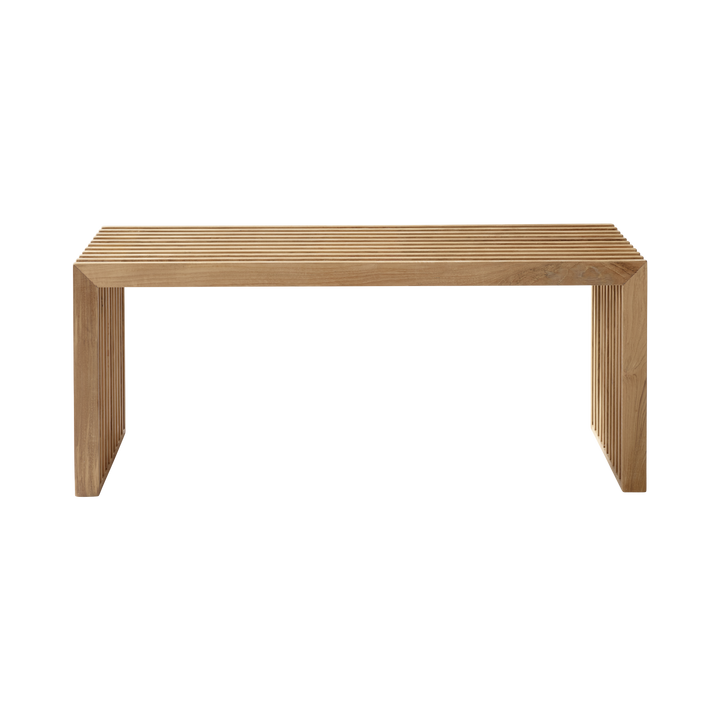 Banchetă Rib Cinas — banchetă din lemn de tec cu structură de coaste, într-un hol modern.