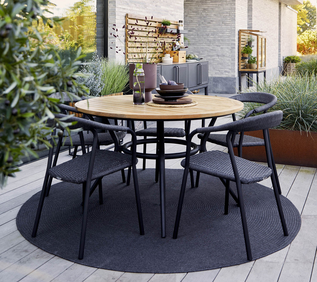 The Decorators: Masa de exterior rotunda Cane-line Joy Taupe/Travertine look